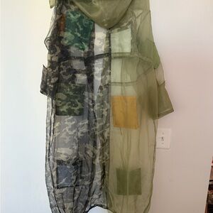 This is an AKIRA sheer camouflage trench coat.